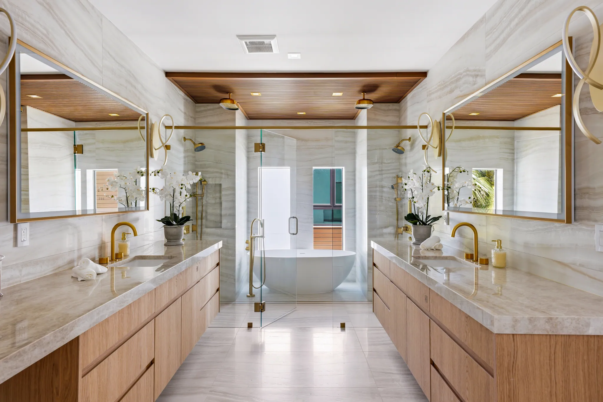 Primary bath with dual vanities, freestanding tub and walk-in shower